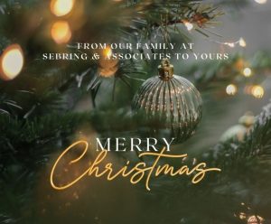 image of tree and ornaments with text From Our Family at Sebring & Associates to yours Merry Christmas